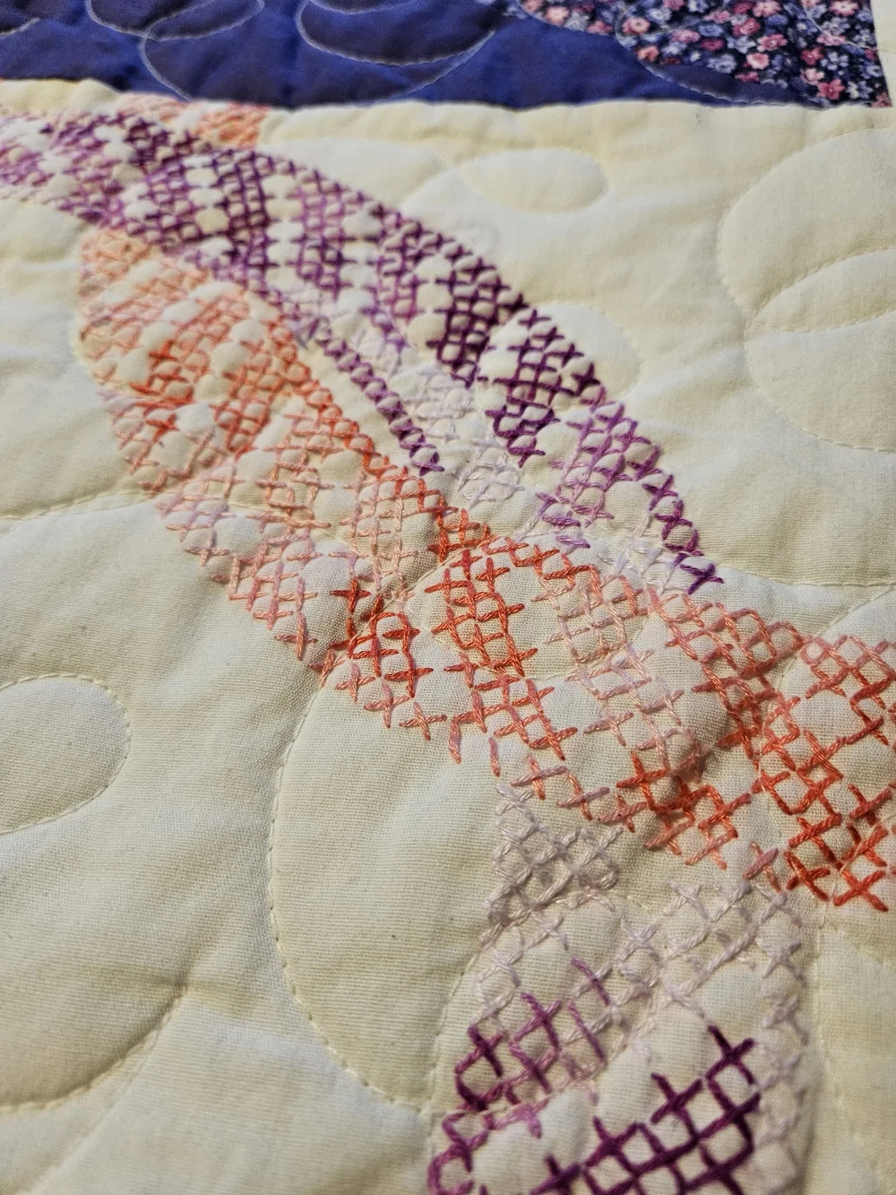 Homemade Purple Patchwork Quilt With Cross-stitch Detail